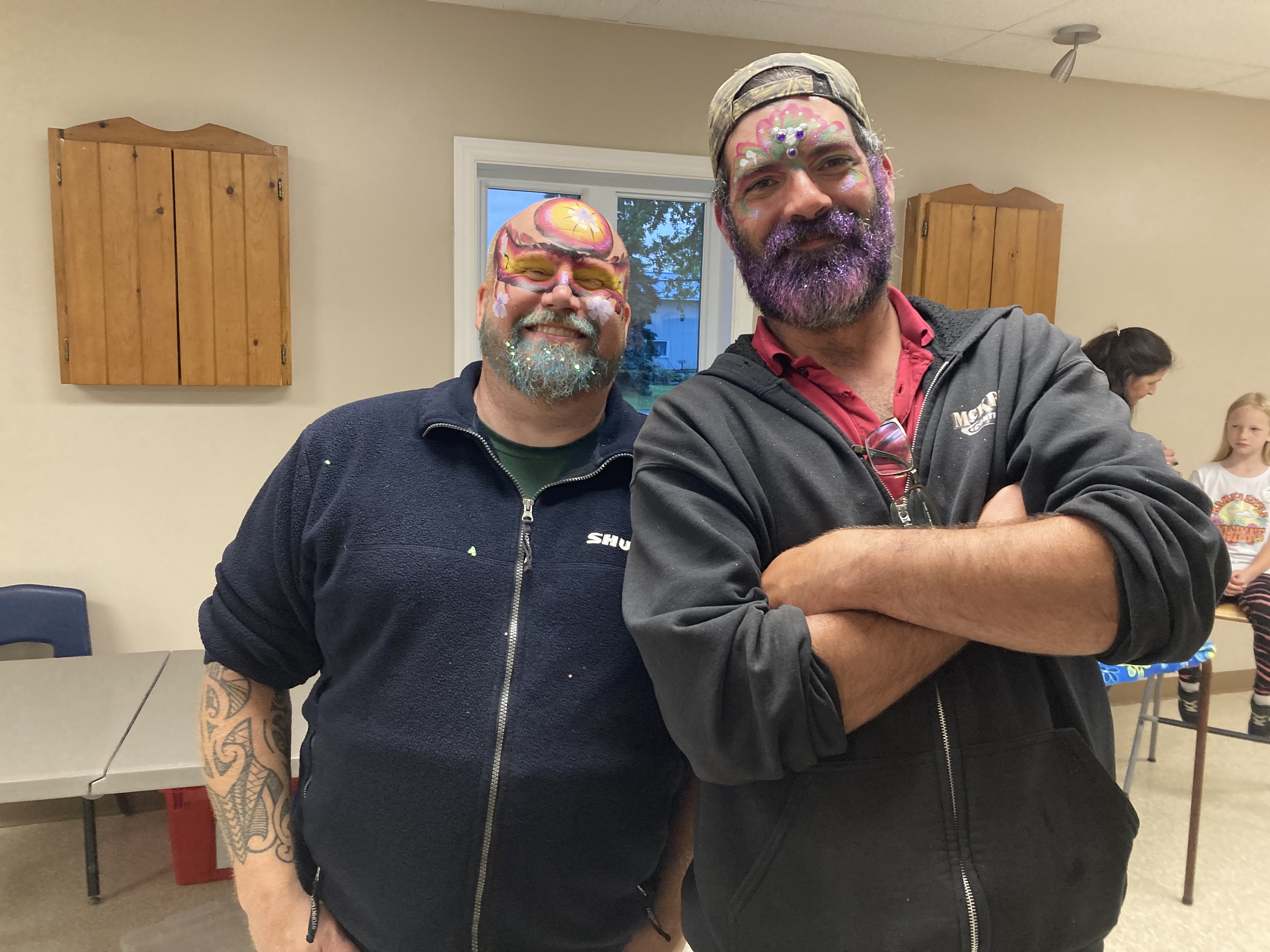 two people with painted faces