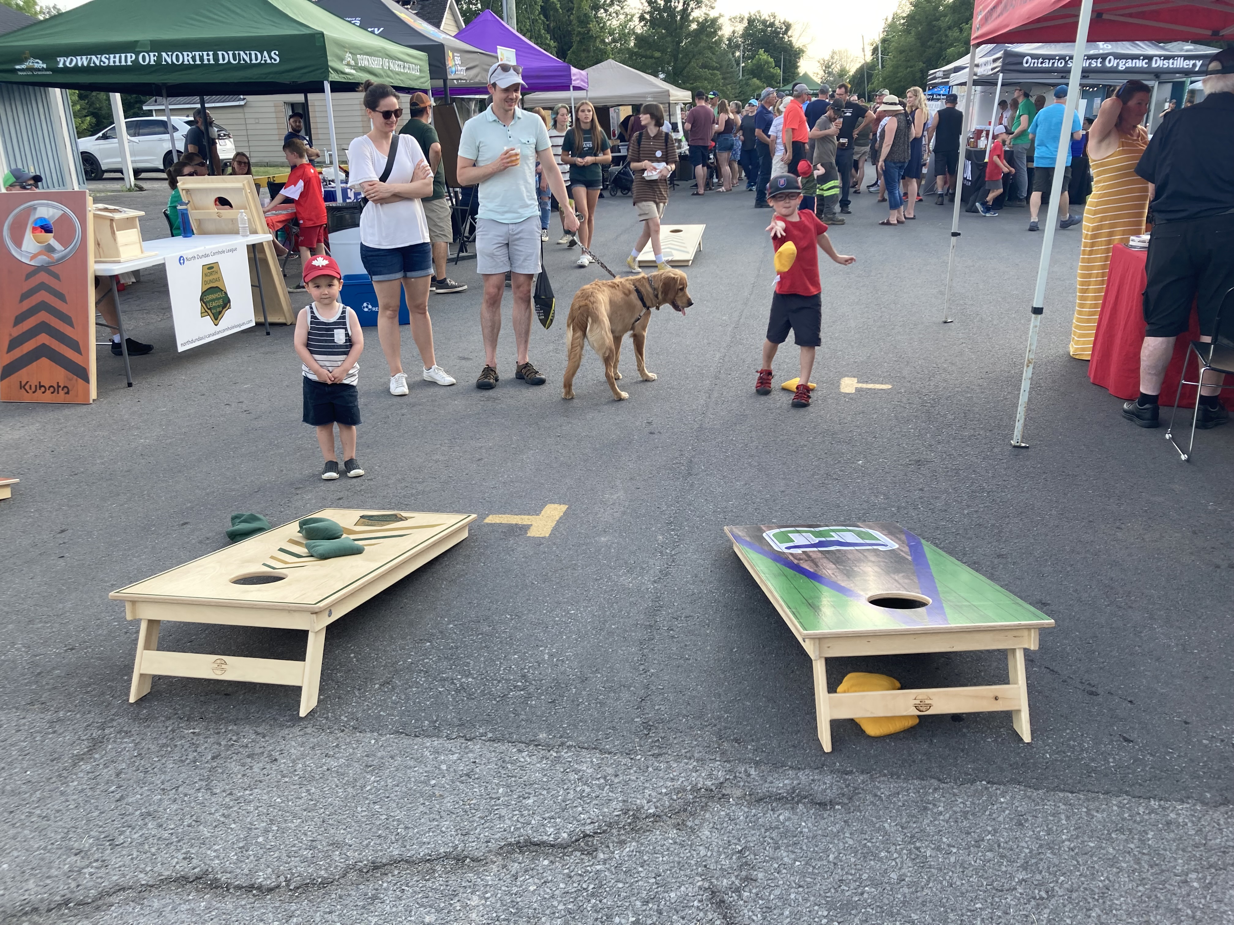 kids playing cornhole game