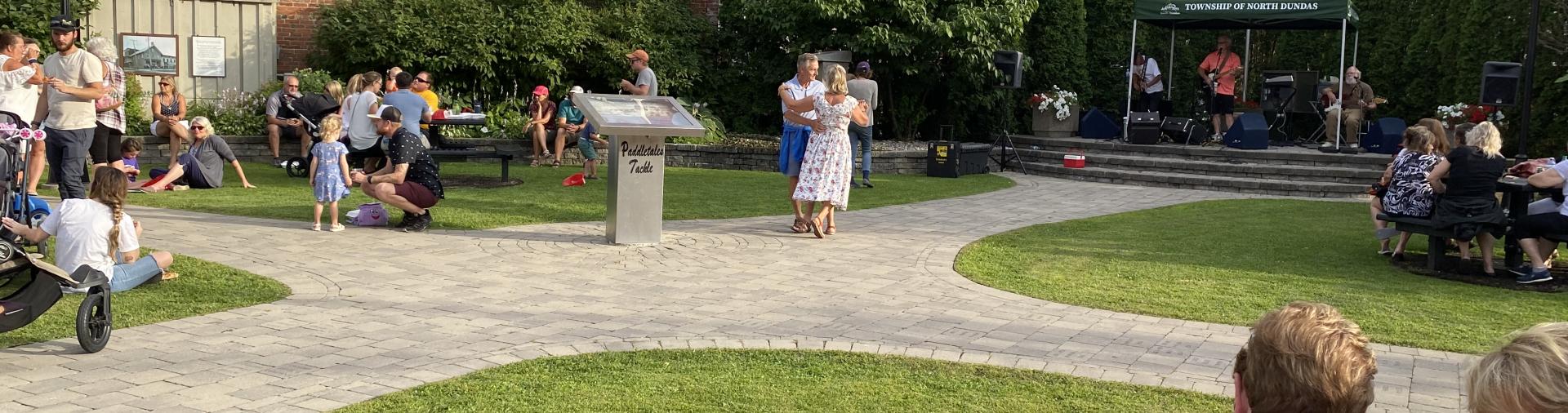 Dancing to live music in Sweet Corner Park at MMOMS Winchester