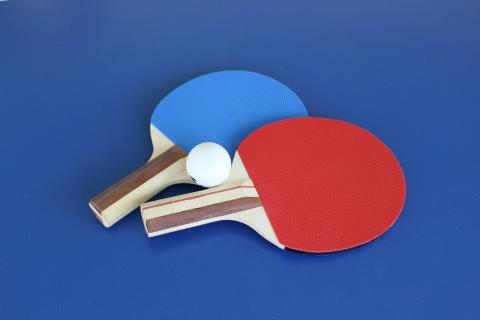 Blue and red ping pong paddles