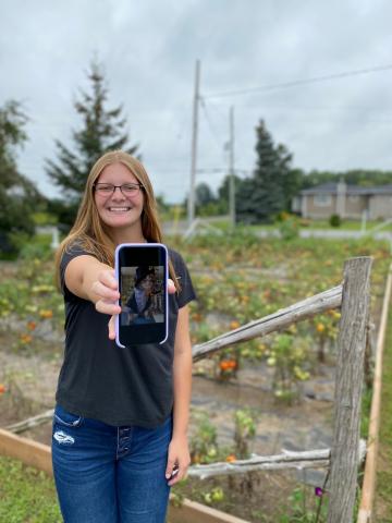 Abby Zersch shows off her beloved cat, named Mr. Marbles, who donned a slick waiter’s outfit for the photo. 