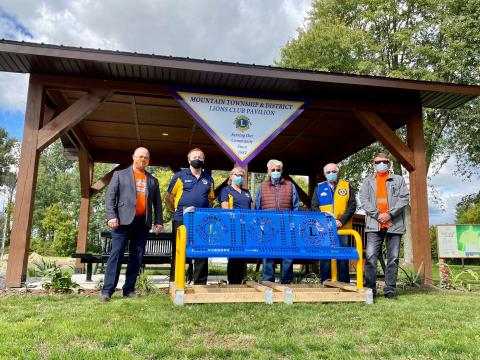 Members of the Lions Club stand by the pavilion