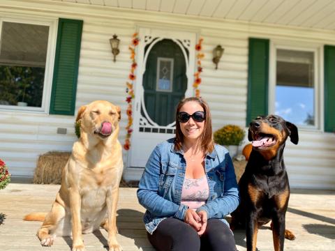 Carrie Paquin sits on her front porch with her adorable pups, Marley and Zeus. 