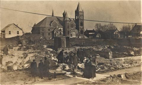 Pictured, a postcard photo that shows people walking amongst the rubble of the Sanders, Soule & Casselman general store and Fisher & Robinson' butcher shop on King Street with the newly-constructed Trinity Methodist Church in the background. Supplied by Ashley Harper.