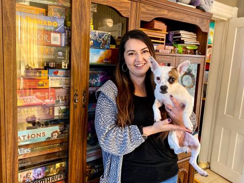 Casandra Spruit holds Eevee, the family dog. 