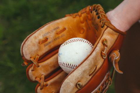 leather baseball glove and ball