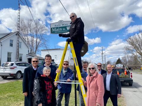 Stephen Ault shows off the new Ault Way ceremonial street signs on Friday, April 22.