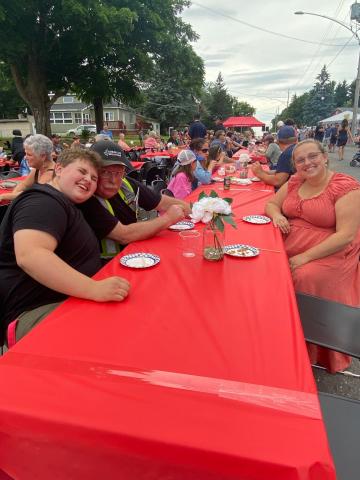 people eating at table outside