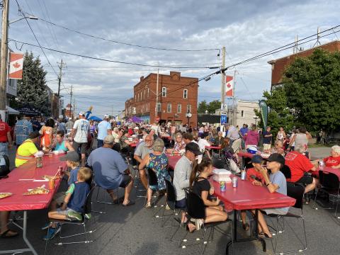 Winchester MMOMS red covered tables on street