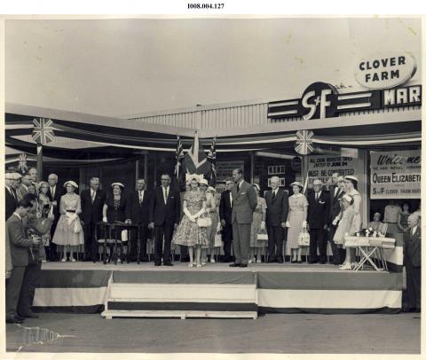 Queen at store on stage during trip