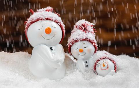 three snowman toys in a row