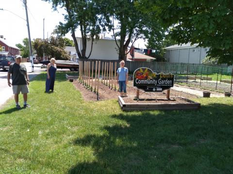 people standing beside garden