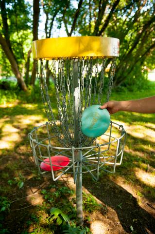 yellow disc golf basket