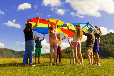kids playing with tarp
